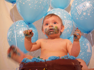 baby cake covered with 1st birthday party balloons