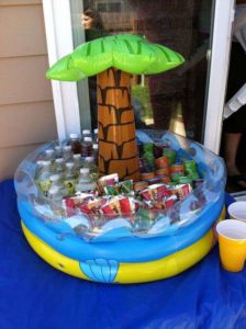kiddy pool used as a kids cooler for s 1st birthday party.